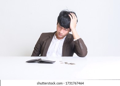 
A Young Asian Man Lost His Job During Covid 19. Stressed Tired Businessman Feels Despair Lost Money Online Or Got Problem Debt