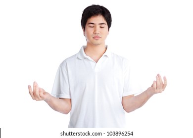 Young Asian Man Meditating Isolated On White Background.