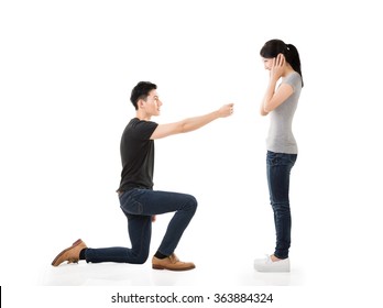 Young Asian Man Propose To His Girlfriend, Studio Shot