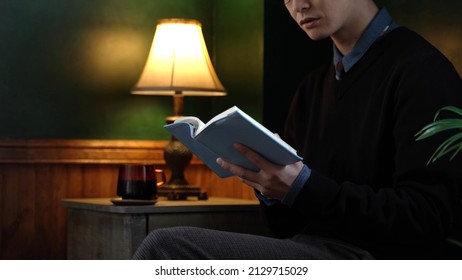 Young Asian Man Reading Book In The Antique Room