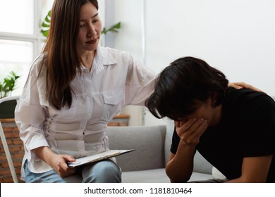 Young Asian Man Received A Treatment From Psychologist At Clinic.