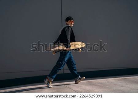 Similar – Image, Stock Photo Surfskateboarding in a sitting position