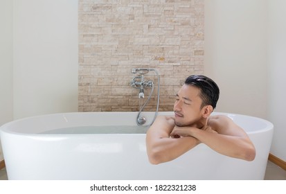 young asian man relax and spa in bathtub