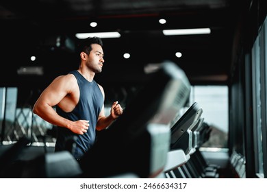 Young Asian Man Running on Treadmill - Fitness Gym Exercise - Powered by Shutterstock