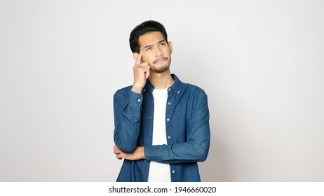 Young Asian Man Serious Thinking While Standing Over Isolated Grey Background, Portrait Of Asia Guy Showing Face Expression  