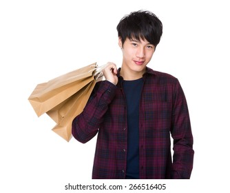 Young Asian Man Shopping And Holding Bags