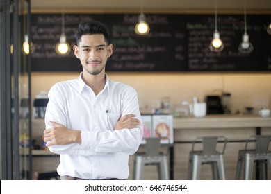 Young Asian Man With Small Business Owner At Restuarant, Startup SME With Woman Working Concept, 20-30 Year Old.