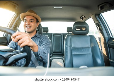 Young Asian Man Smiley Driving Car. 