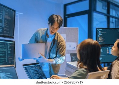 Young Asian man software developers mentor leader manager Verification and validation in software testing ensure developers drive the development of engineering technologies Programmer development