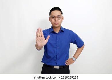 Young Asian Man Standing With Stop Hand Gesture. Isolated On White Background