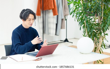 Young Asian Man Talking In Video Conference.