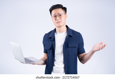 Young Asian Man Using Laptop On White Background