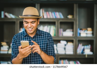 Young asian man using smartphone.