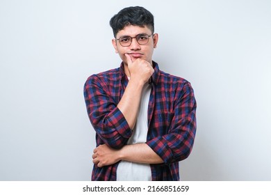 Young Asian Man Wearing Casual Shirt And Glasses Thinking Looking Tired And Bored With Depression Problems With Crossed Arms Isolated On White Background