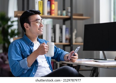 Young Asian Man Working At Office