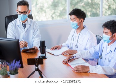 A Young Asian Medical Student Studied Medicine Through An Online Video Conferencing System Taught By An Asian Adult Doctor. Conferencing Concepts Or Online Video Conferencing Systems By Doctors