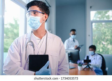 A Young Asian Medical Student Studied Medicine Through An Online Video Conferencing System Taught By An Asian Adult Doctor. Conferencing Concepts Or Online Video Conferencing Systems By Doctors