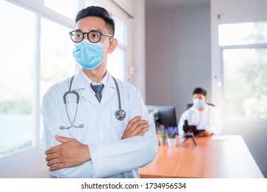 A Young Asian Medical Student Studied Medicine Through An Online Video Conferencing System Taught By An Asian Adult Doctor. Conferencing Concepts Or Online Video Conferencing Systems By Doctors