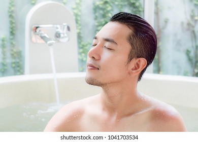 Asian man singing in bathroom commercial