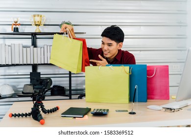 Young Asian Millenial Male Vlogger Recording A Video Social Media Presents Shopping Online To Audiences Via Live Streaming - Live Marketing Concept