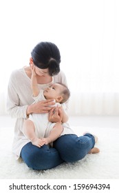 Young Asian Mother And Baby