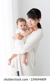 young asian mother and baby