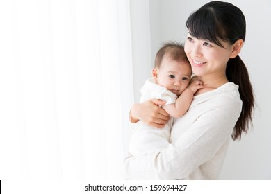 Young Asian Mother And Baby