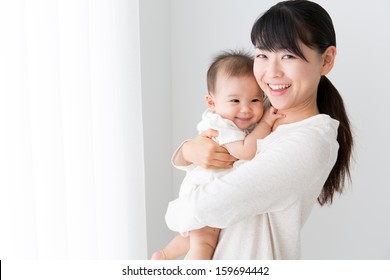 Young Asian Mother And Baby