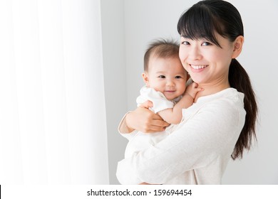 Young Asian Mother And Baby