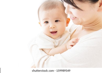 Young Asian Mother And Baby In The Room