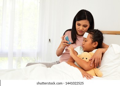 Young Asian Mother Child Sick Care At Home