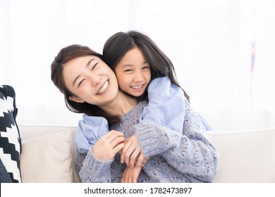 Young Asian Mother And Daughter