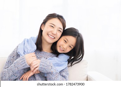 Young Asian Mother And Daughter