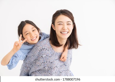 Young Asian Mother And Daughter