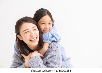 young asian mother and daughter