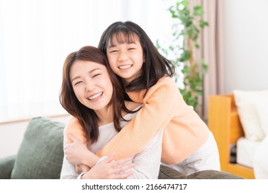 Young Asian Mother And Daughter