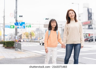 Young Asian Mother And Daughter , School Bag