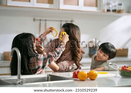 Similar – Image, Stock Photo Mother and son having fun while studying documents on yellow file