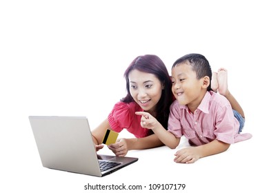 Young Asian Mother And Her Son Shopping Online, Isolated On White