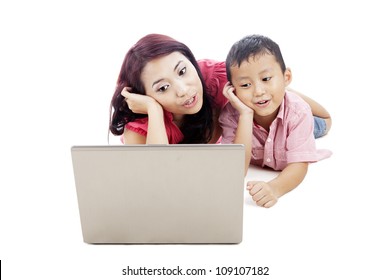 Young Asian Mother Singing Together With Her Son Using Laptop Computer