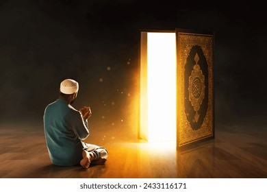 Young asian muslim man with beard reading and learn holy book translation Al-Qur'an in the mosque at night