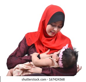 Young Asian Muslim Mother Breastfeeding Her Cute Baby Girl Isolated On White Background