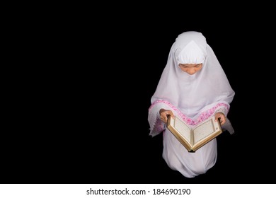 Young Asian Muslim In White Hijab Read Al Quran Over Black Background