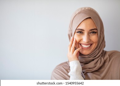 Young asian muslim woman in head scarf smile. Beautiful middle eastern woman wearing abaya. Arabian woman with happy smile. Strict formal outfit and elegant appearance. Islamic fashion.