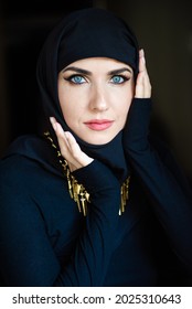 Young Asian Muslim Woman In Head Scarf Smile. Beautiful Middle Eastern Woman Wearing Abaya. Arabian Woman. Strict Formal Outfit And Elegant Appearance. Islamic Fashion.