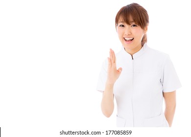 Young Asian Nurse Apologizing On White Background