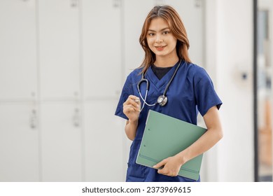 Young Asian nurse or Female medical assistant in clinic - Powered by Shutterstock