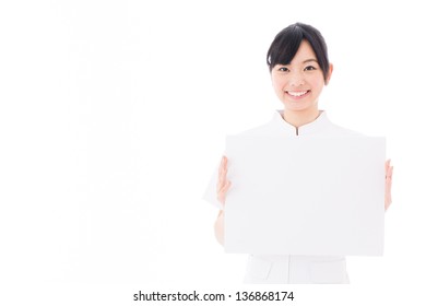 A Young Asian Nurse Holding Blank White Board On White Background