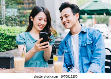 Young Asian people working together at coffee shop - Powered by Shutterstock