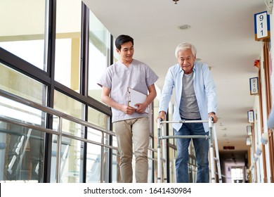 young asian physical therapist working with senior man on walking using a walker - Powered by Shutterstock